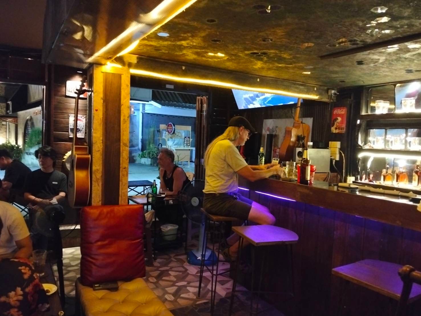 Cafe LungChang bar interior with warm golden lighting